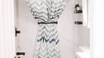 Hair dryer, towels, shampoo, toilet paper