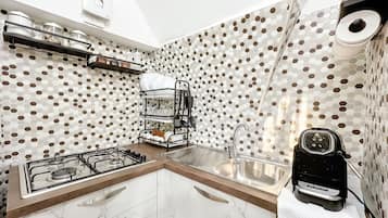 Fridge, stovetop, coffee/tea maker, cookware/dishes/utensils