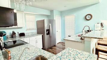 Townhome, Multiple Beds, Patio (Saltwater Solace) | Private kitchen | Dining tables