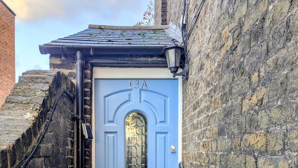 A blue door with the number 13A, a small window, and a metal gate. - 2 Bedroom House with Garden and Free Parking (Greater London)