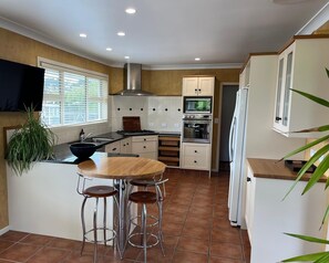 Private kitchen - Mount Taranaki Basecamp: 4BR Farmhouse + Games Room (Mahoe)