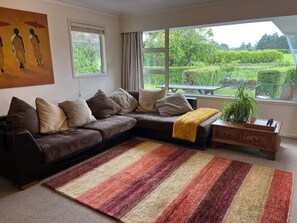 Living area - Mount Taranaki Basecamp: 4BR Farmhouse + Games Room (Mahoe)