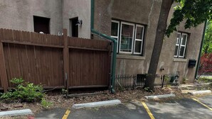 A parking area with yellow lines and a number '08' painted on the ground. - Cute 1-bedroom condo in Denver's Cap Hill neighborhood (Denver)
