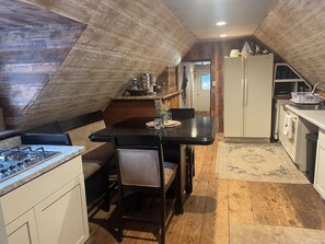 Fridge, microwave, coffee/tea maker, cookware/dishes/utensils