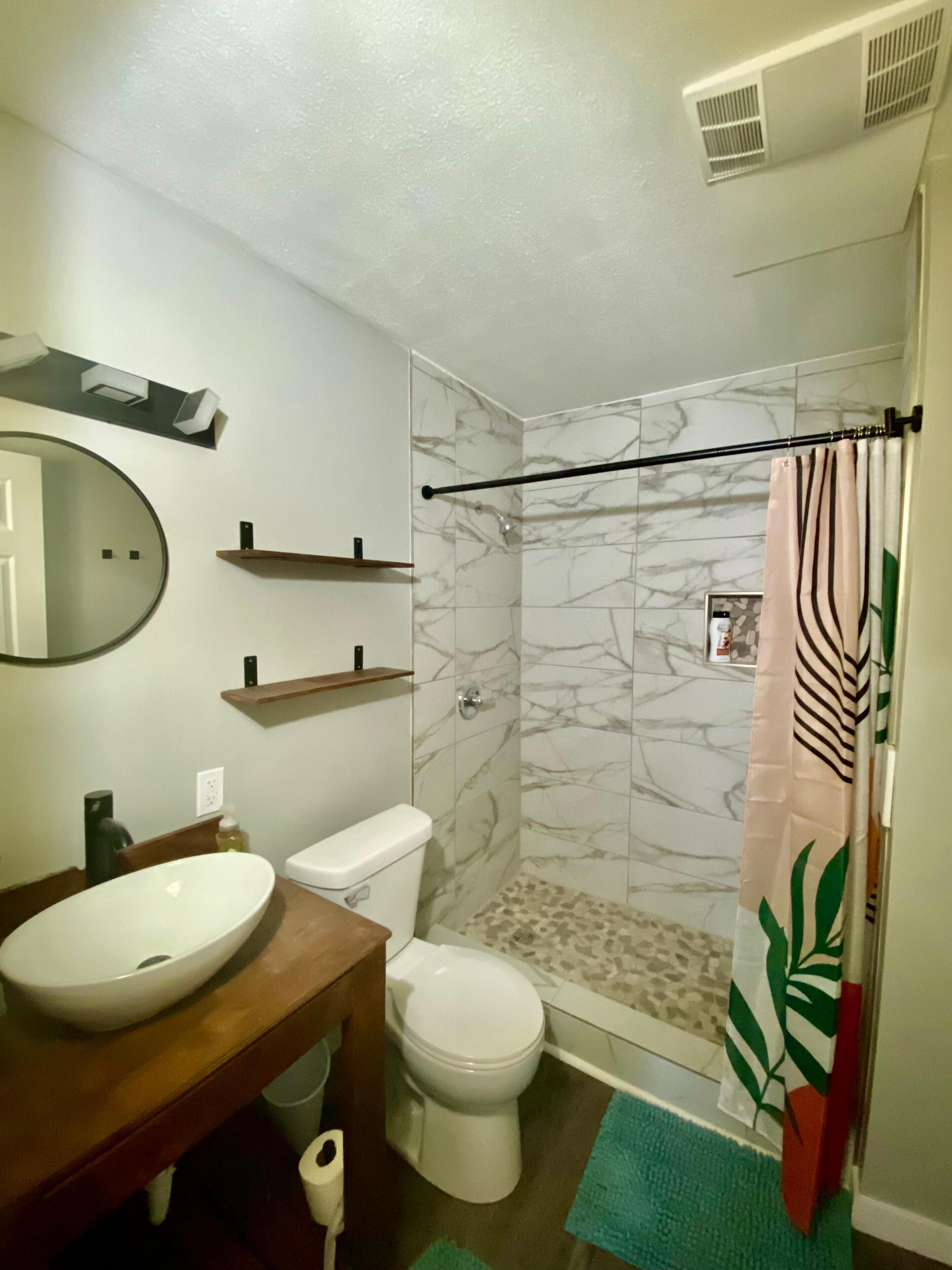 Shower, towels, soap, toilet paper