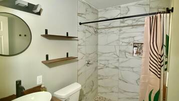 Shower, towels, soap, toilet paper