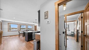 A spacious kitchen with a central island, large windows, and a view of the outdoors. - Mallard Lake Retreat (Jackson)
