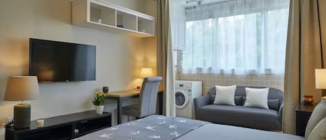 Superior Studio, Courtyard View | Living area | 42-inch LCD TV with cable channels