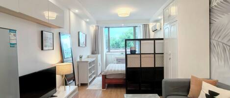 Standard Studio Suite, City View | Living area | 42-inch LCD TV with cable channels, offices