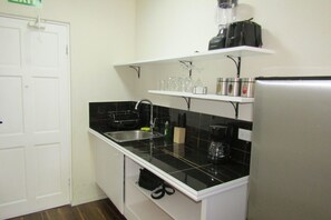 Fridge, microwave, stovetop, coffee/tea maker