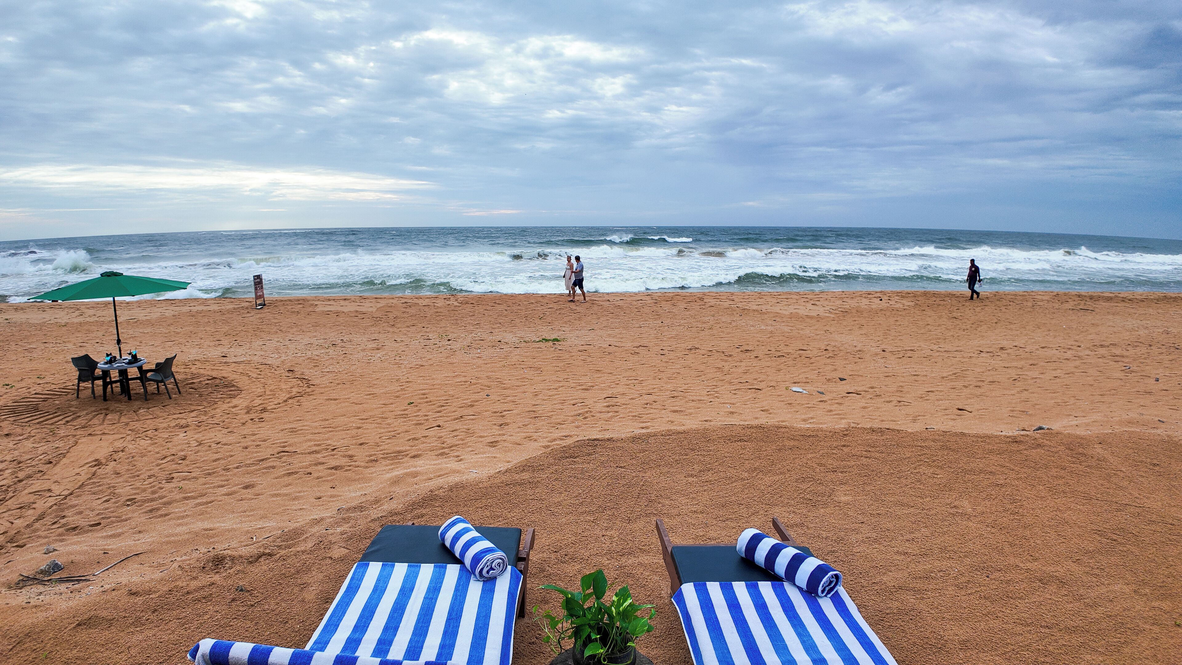 On the beach, sun loungers, beach umbrellas, beach towels