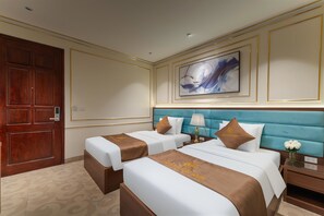 Family Double or Twin Room | Desk, laptop workspace, blackout drapes, soundproofing - Grand Luxury Hotel (Tu Son)