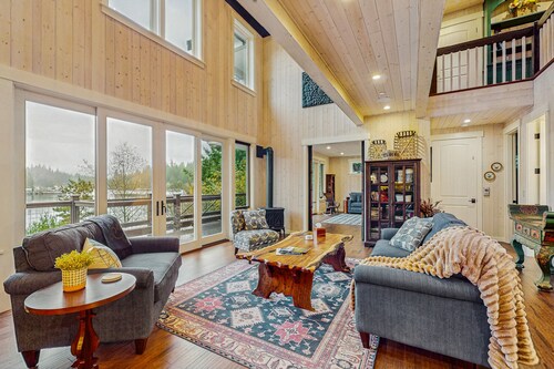 Luxury waterfront home with hot tub, dock, game room, and stunning views