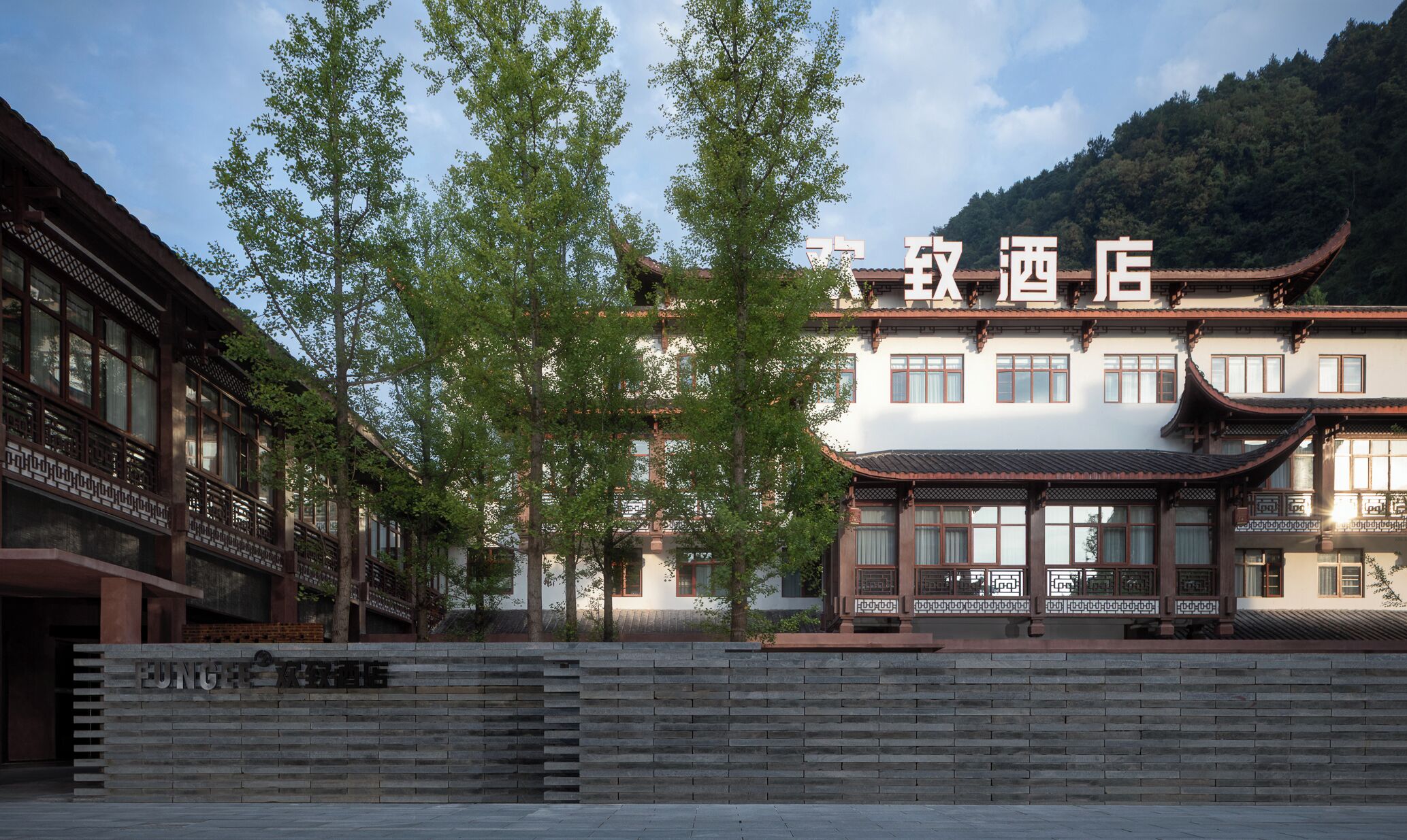 A traditional Chinese building with a sign that reads "Hotel".
