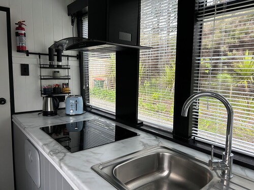 Escape to Tranquillity: The Bus Stop Your Tiny Home Bus Retreat