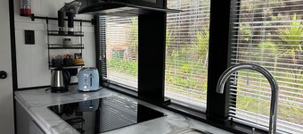 Escape to Tranquillity: The Bus Stop Your Tiny Home Bus Retreat