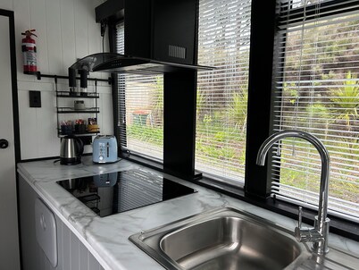 Escape to Tranquillity: The Bus Stop Your Tiny Home Bus Retreat