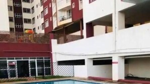 A swimming pool with clear blue water, surrounded by a stone border and a tiled deck. - The Greenzone Apartments Thindigua (Kiambu)