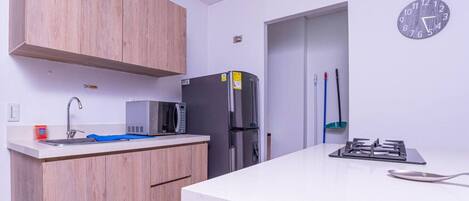 Fridge, microwave, stovetop, coffee/tea maker