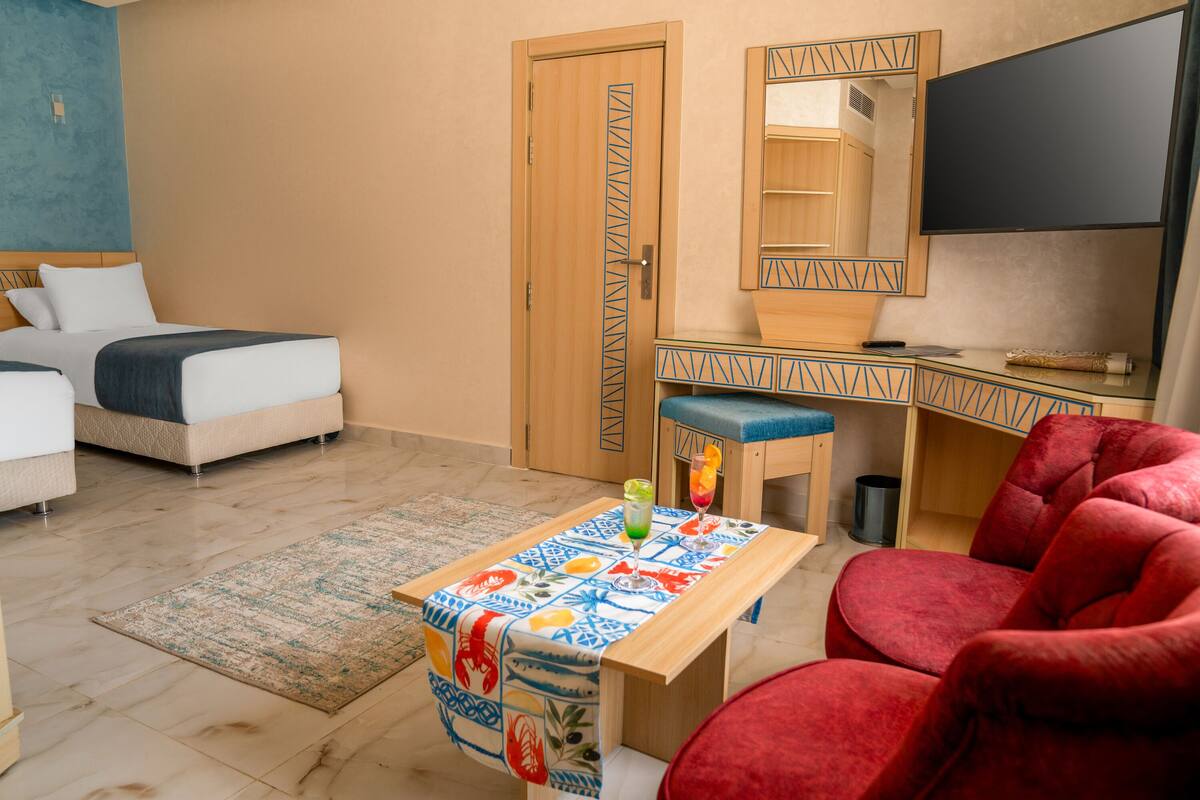 Deluxe Twin Room, Patio, Pool View | In-room safe, blackout drapes