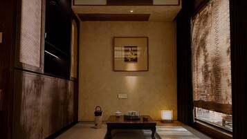 Desk, laptop workspace, blackout drapes, iron/ironing board