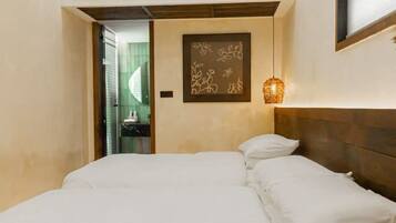 Signature Twin Room, Courtyard View | Desk, laptop workspace, blackout drapes, iron/ironing board