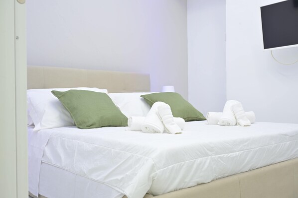 Habitació quàdruple familiar | Caixa forta a l'habitació i cortines opaques