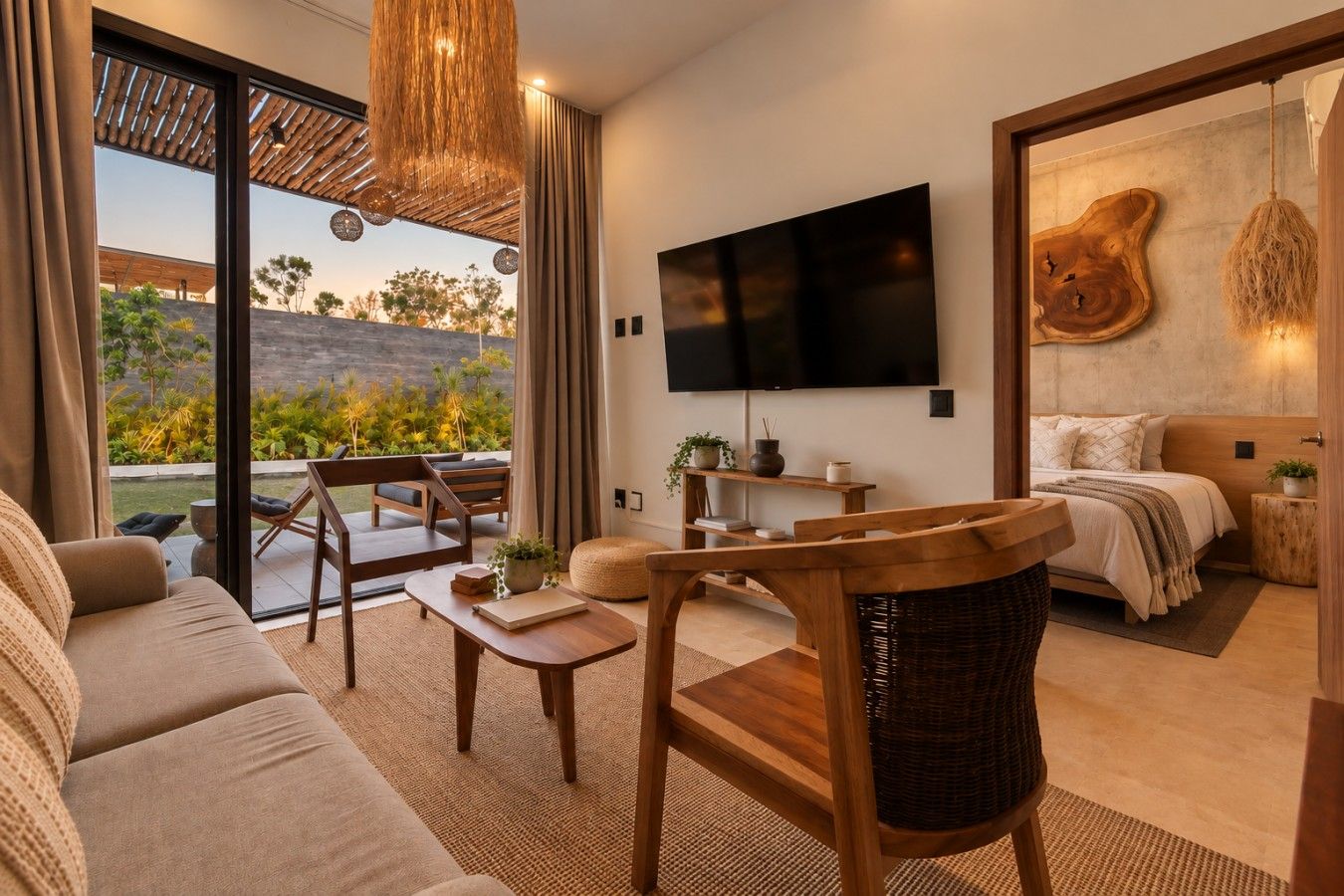 A modern living room with a sofa, a wooden table, and a TV mounted on the wall.