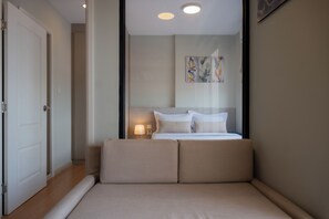 Apartment, Balcony, City View | Living area - The Moment Apartment at the Star Polaris (Phnom Penh)