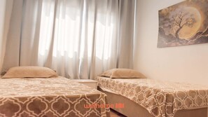 2 chambres, fer et planche à repasser, Wi-Fi, draps fournis