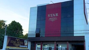 A hotel with a prominent 'Star Hotel' sign, a modern facade, and a visible entrance. - Star Hotel (Limoeiro)