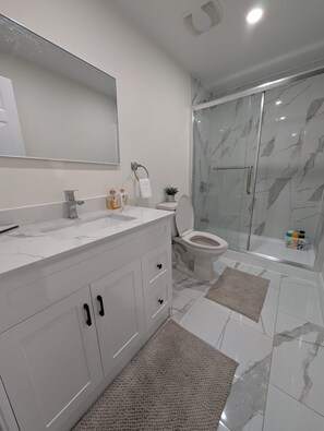 Hair dryer, towels, soap, toilet paper