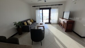 Living area - Stunning Oceanview Condo Steps to Playa Flamingo w/ Pool, BBQ & Beach Access (Playa Flamingo)