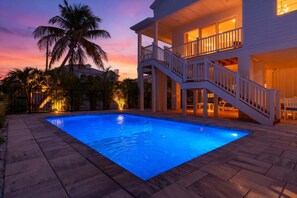 Outdoor pool, a heated pool - Brand New Luxury 5BR 4.5B home Heated Private Pool. Walk to Beach 1 Block (Fort Myers Beach)