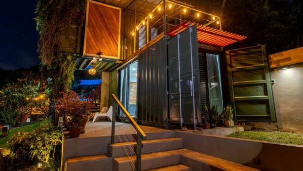 A modern house with a wooden deck, a staircase, and a glass door. - Mata e’ Plátano Guesthouse Suite private pool (Mata de Platano)