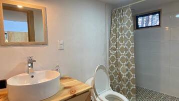 Shower, towels, soap, toilet paper
