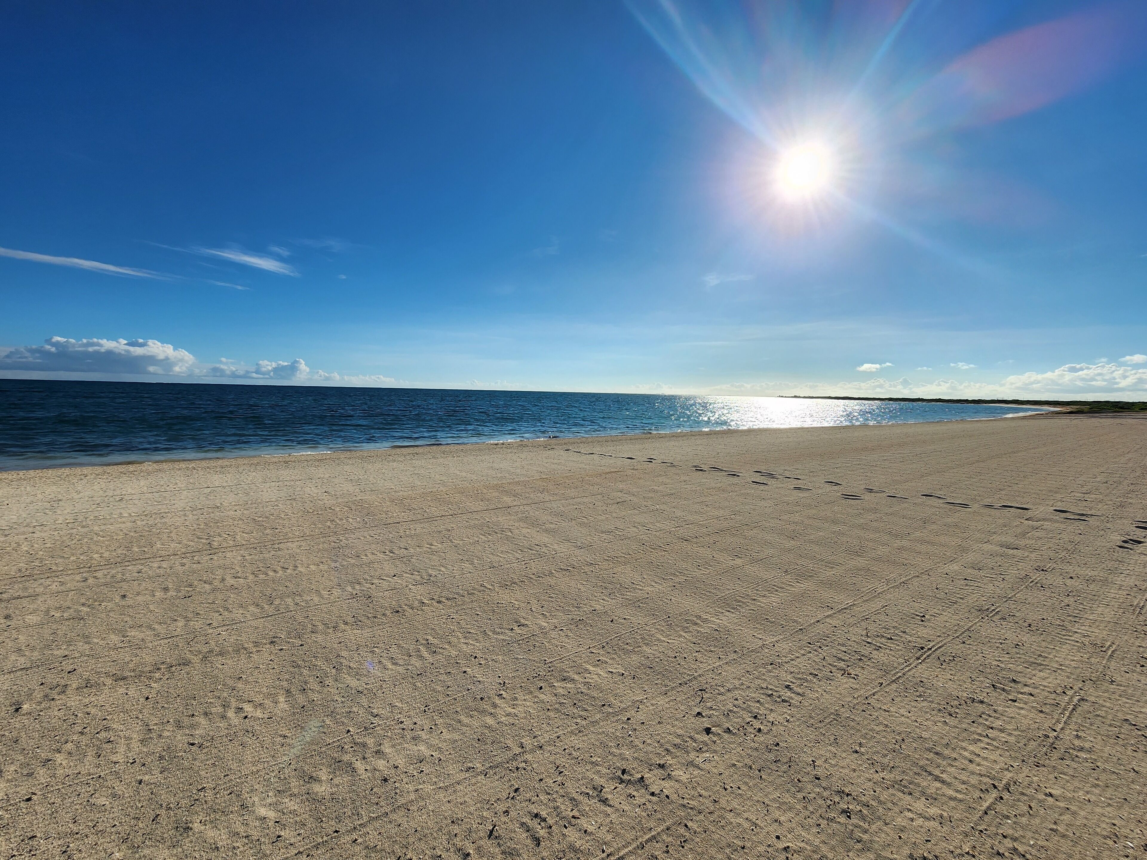 On the beach, sun loungers, beach towels