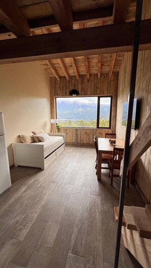 Deluxe Bungalow | Living area | Flat-screen TV - Lomas Schuss ARG41 (San Carlos de Bariloche)