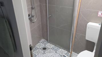Shower, free toiletries, towels, soap