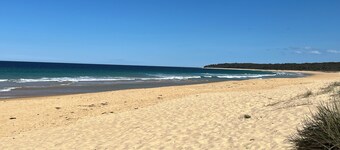 Nestled in the bush overlooking the river and 5 minutes to patrolled beach