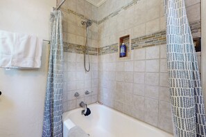 A bathroom with a bathtub, shower, and a towel rack. - 10 Mi to Bear Valley Resort: Serene Mtn Retreat (Arnold)