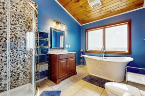 A bathroom with a freestanding bathtub, a glass shower enclosure, and a wooden vanity. - Chautauqua Lake Views! Bemus Point Getaway (Bemus Point)
