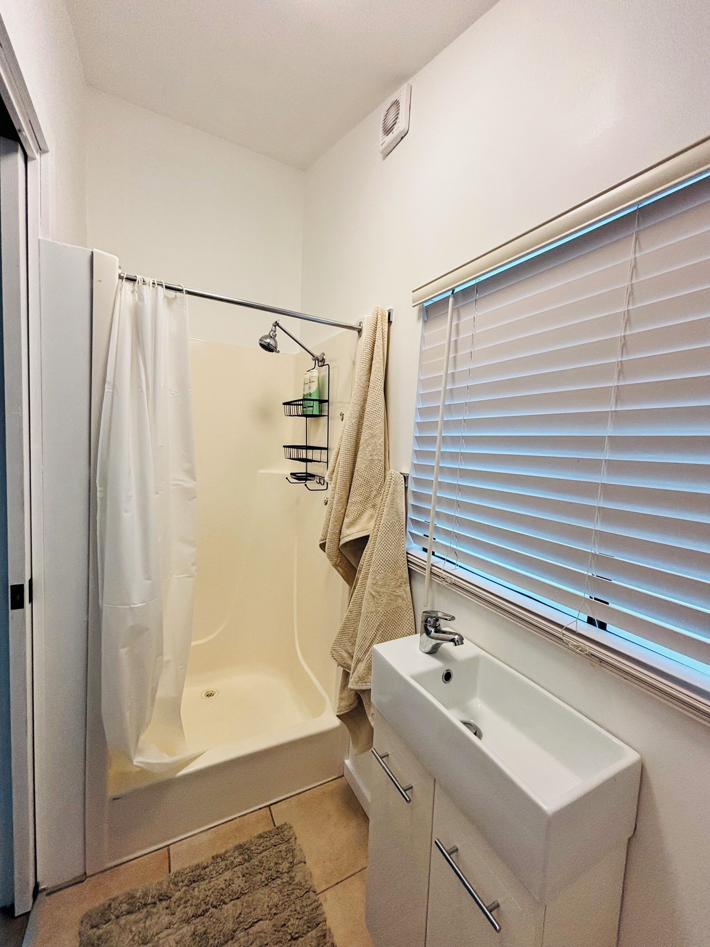 Shower, hair dryer, towels, soap