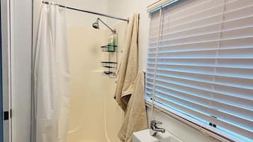 Shower, hair dryer, towels, soap