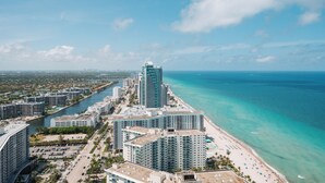 A coastal cityscape with high-rise buildings, a marina, and a beach. - Oceanfront 36th Floor Condo with Stunning Views Resort and Beach Access (Hollywood)