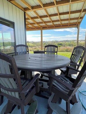 Outdoor dining - Modern home on acreage with pond, trails, rolling hills, and sunset views (Winterset)