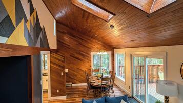 Smart TV, fireplace, books, computer monitors