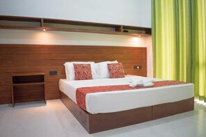 Deluxe Double or Twin Room, Pool View | In-room safe, desk, laptop workspace, blackout drapes