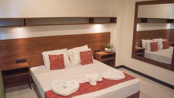 Deluxe Triple Room | In-room safe, desk, laptop workspace, blackout curtains