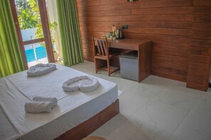 Deluxe Double or Twin Room, Pool View | In-room safe, desk, laptop workspace, blackout drapes